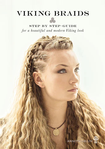 Et bogomslag med titlen "Viking Braids (Eng) - Step by Step Guide for a Beautiful and Modern Viking Look" af Annette Colin viser en kvinde med langt, bølget blond hår stylet i indviklede vikingeflettede frisurer.